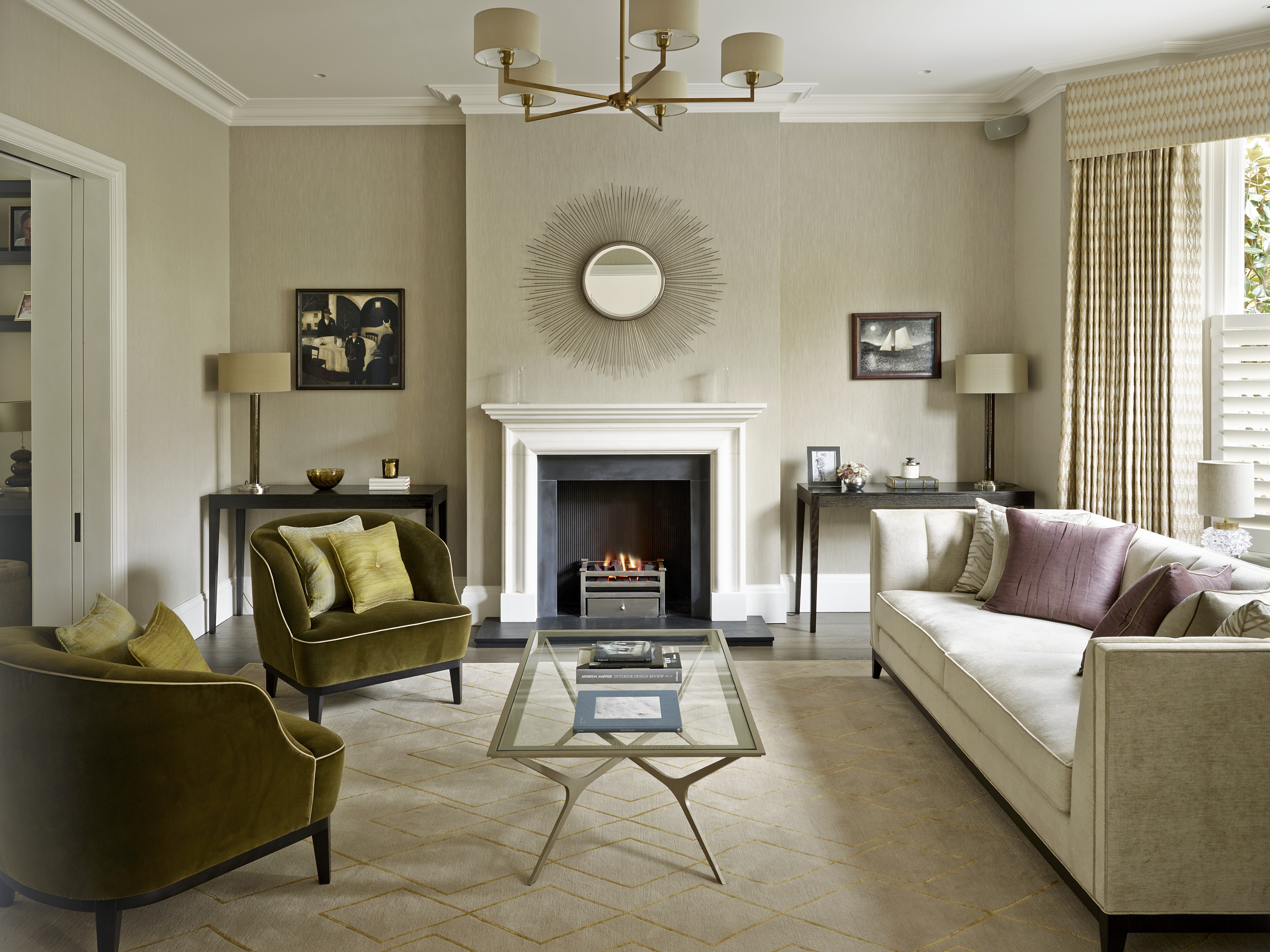 Elegant living room scheme with moss green velvet armchairs and diamond pattern rug in wool and silk.
